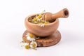 Dried chamomile in a wooden mortar. Herbal medicine concept. Generative AI