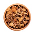 Dried golden chanterelle mushroom, Cantharellus cibarius, in a wooden bowl Royalty Free Stock Photo