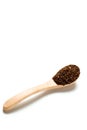 A dried chili flakes in a wooden spoon