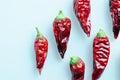 Dried chili peppers on a light blue background
