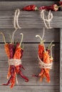 Dried chili peppers on a wooden background. Royalty Free Stock Photo