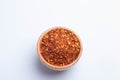 dried chili peppers in a wooden cup on a white background Royalty Free Stock Photo
