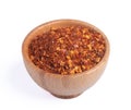 dried chili peppers in a wooden cup on a white background Royalty Free Stock Photo