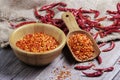 Dried chilies with chili powder, pepper, and red paprika in a wooden bowl Spicy seasoning Healthy food, top view Royalty Free Stock Photo