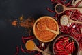Dried chilies with chili powder, pepper, and red paprika in a wooden bowl Spicy seasoning Healthy food, top view Royalty Free Stock Photo