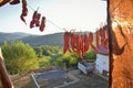 Dried chilies hanging on a rope in a village in susnset,