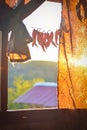 Dried chilies hanging on a rope in a village in susnset Royalty Free Stock Photo