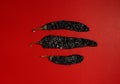 Dried Chilis Red background, chile guajillo Pasilla mexican spice flat lay