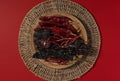 Dried Chilis on wood dish Red background Pasilla and Guajillo mexican spice Royalty Free Stock Photo