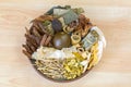 Dried Chinese mixed herbs to make cooling drinks in traditional Chinese medicine on wooden background