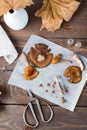 Dried chopped fly agarics stacked in a small jar and dry mushrooms on parchment and scissors on a wooden table. Microdosing and Royalty Free Stock Photo