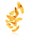 Dried chopped mango slices falling down, isolated on white background