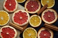 Dried citrus slices on a wooden board on a dark background Royalty Free Stock Photo