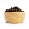 dried cloves wooden bowl on white