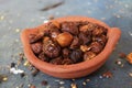 Dried coccinia grandis in the red clay pot. it is also know as Mithuku Vathal Royalty Free Stock Photo