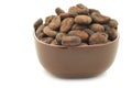 Dried cocoa beans in a brown bowl Royalty Free Stock Photo