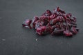 Handful of red sun-dried cranberries on black background Royalty Free Stock Photo