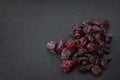 Handful of red sun-dried cranberries on black background Royalty Free Stock Photo