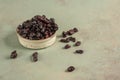 Dried cranberry fruit in a bowl on green Royalty Free Stock Photo