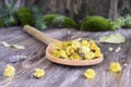 Dried dandelion flowers on wooden table background