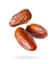 Dried dates close up in the air on a white background Royalty Free Stock Photo