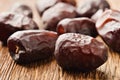 Dried dates close-up on a wooden board Royalty Free Stock Photo