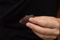 Dried Dates in Female Hand. Offering a handful of glossy, sweet dried dates