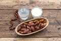 Dried dates fruits on a branch, a glasses of water and milk on a wooden table Royalty Free Stock Photo