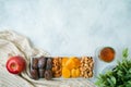 Dried dates, fruits and nuts for Jewish holiday Tu Bishvat celebration. Top view modern background Royalty Free Stock Photo