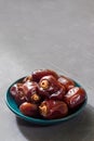 Dried dates on gray background. Royalty Free Stock Photo