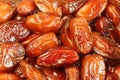 Dried dates situated arbitrarily. Food background Royalty Free Stock Photo