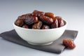 Dried Dates In A White Bowl On A White Background. Generative AI Royalty Free Stock Photo