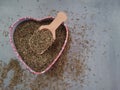 Dried, dehydrated oregano (Origanum vulgare) in a heart-shaped bowl Royalty Free Stock Photo