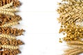 Dried ears of wheat, oats and other grains lie on a white background wood Royalty Free Stock Photo