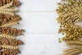 Dried ears of wheat, oats and other grains lie on a white background wood Royalty Free Stock Photo