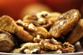 Dried fig and whole and cracked walnuts on white ceramic plate Royalty Free Stock Photo