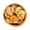 Sun dried, ripe and whole common figs, Ficus carica, in wooden bowl