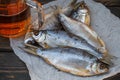 Dried fish and beer on the table. Traditional Russian appetizer Royalty Free Stock Photo