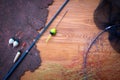 Fish fishing rods on a wooden background