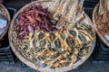 Dried fish on a wicker basket in market in the Vietnam