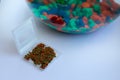 Dried flakes for fish in container for feeding pet. Aquarium