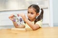 Dried flower art. Herbarium. Child making picture from pressed flowers. Royalty Free Stock Photo