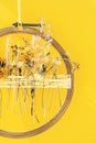 Dried flower decoration. DIY floral door wreath from yellow dry summer flowers