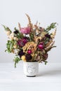 Dried flowers arrangement. Sustainable floristry. Home decor with dried flowers.