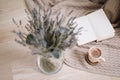 Dried flowers and a cup of cappuccino with book, spring concept. top view. flatlay