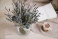 Dried flowers and a cup of cappuccino with book, spring concept. top view. flatlay