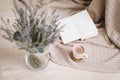 Dried flowers and a cup of cappuccino with book, spring concept. top view. flatlay