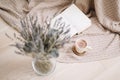 Dried flowers and a cup of cappuccino with book, spring concept. top view. flatlay