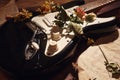 Dried flowers and electric guitar on old music notes closeup. Selective focus Royalty Free Stock Photo