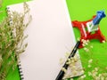 Dried flowers and empty notebook page with decoration Royalty Free Stock Photo